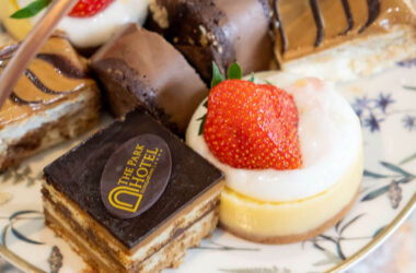 Elegant dessert platter with assorted cakes at The Park Hotel; experience indulgent dining in a luxurious setting.
